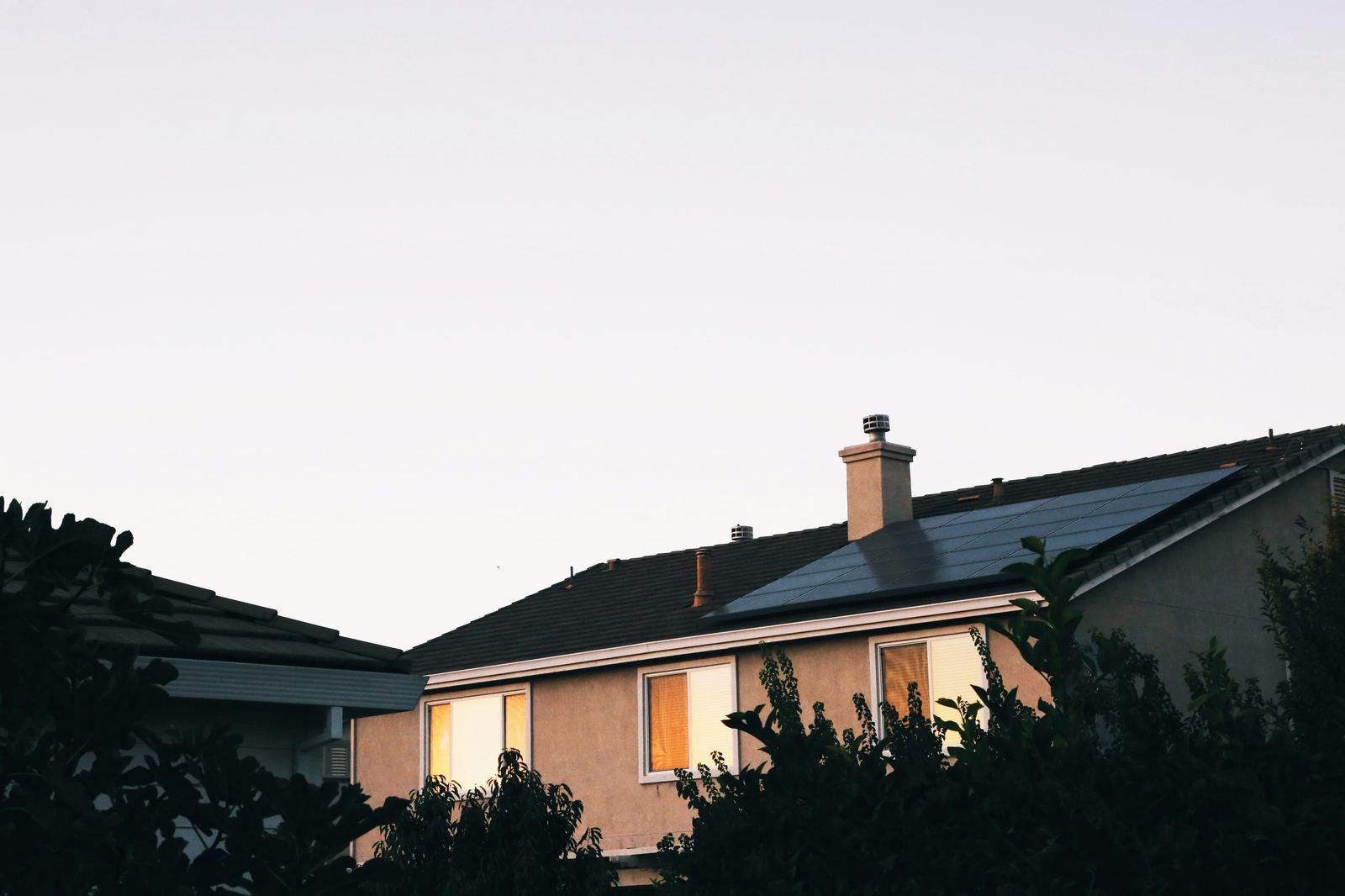 Home with solar and battery storage at dusk