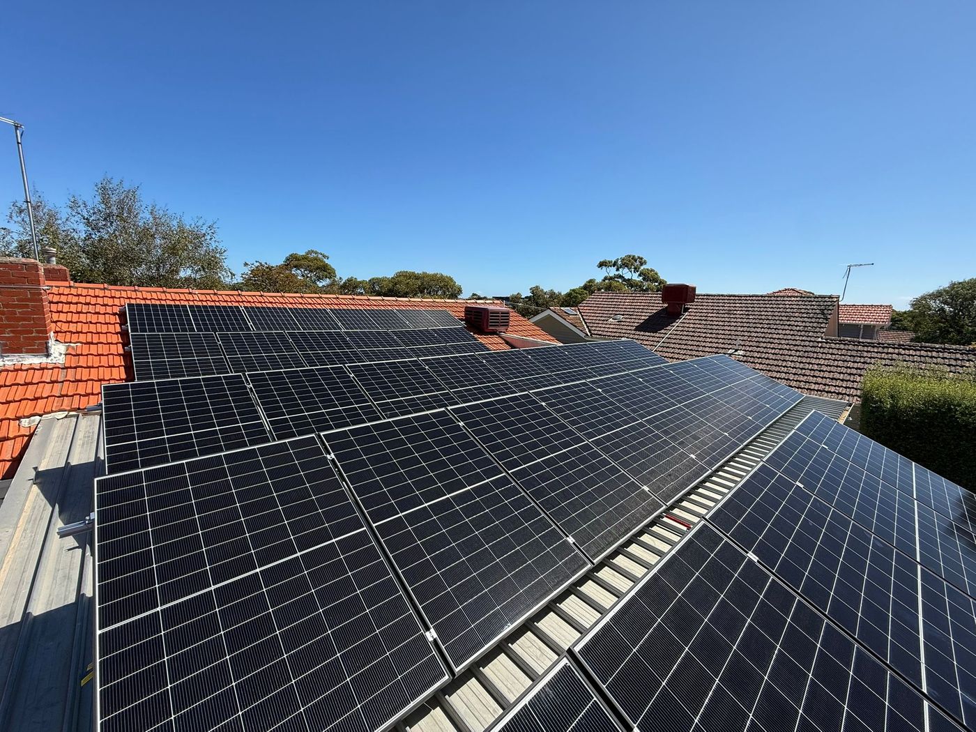 Large solar array covering a metal roof